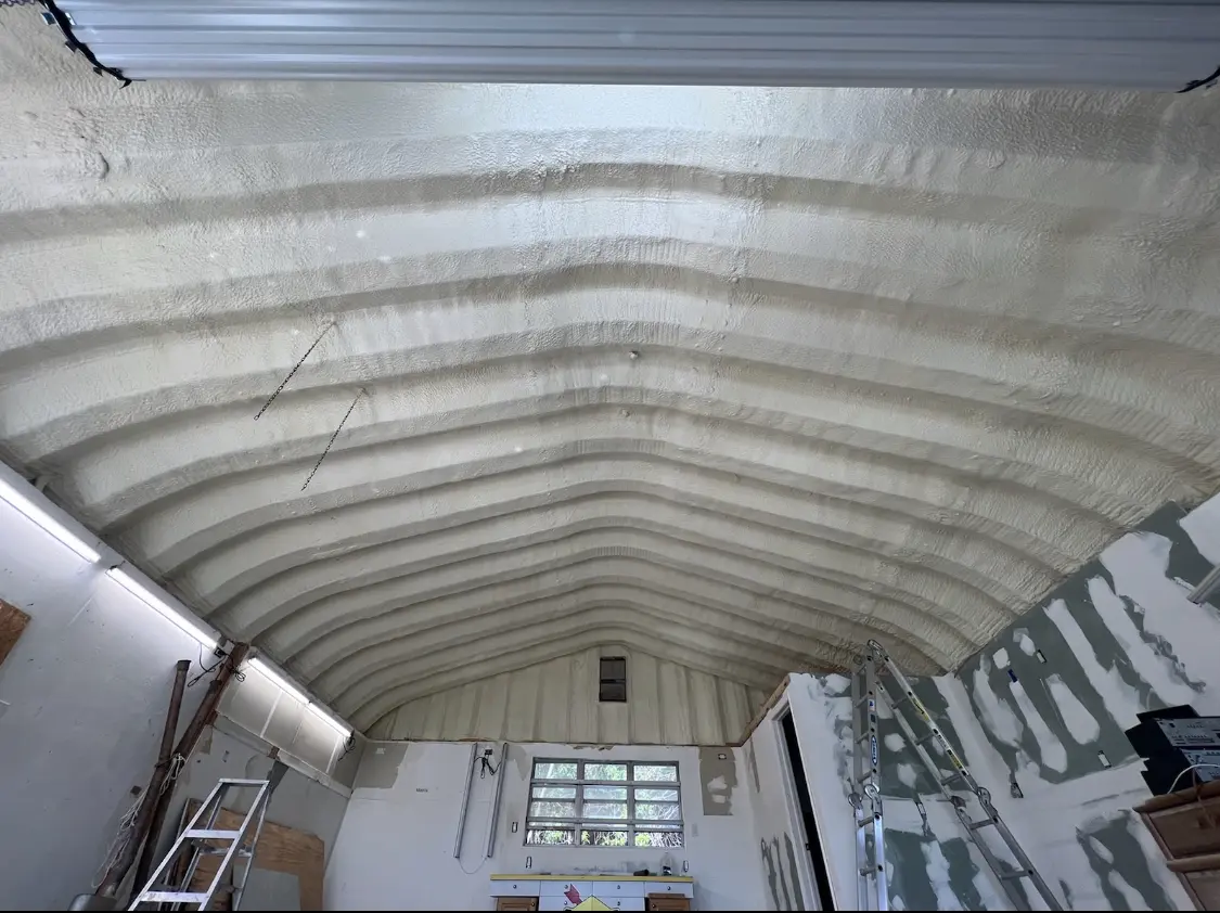 Spray polyurethane foam applied to the underside of a metal roof deck in Kimberly